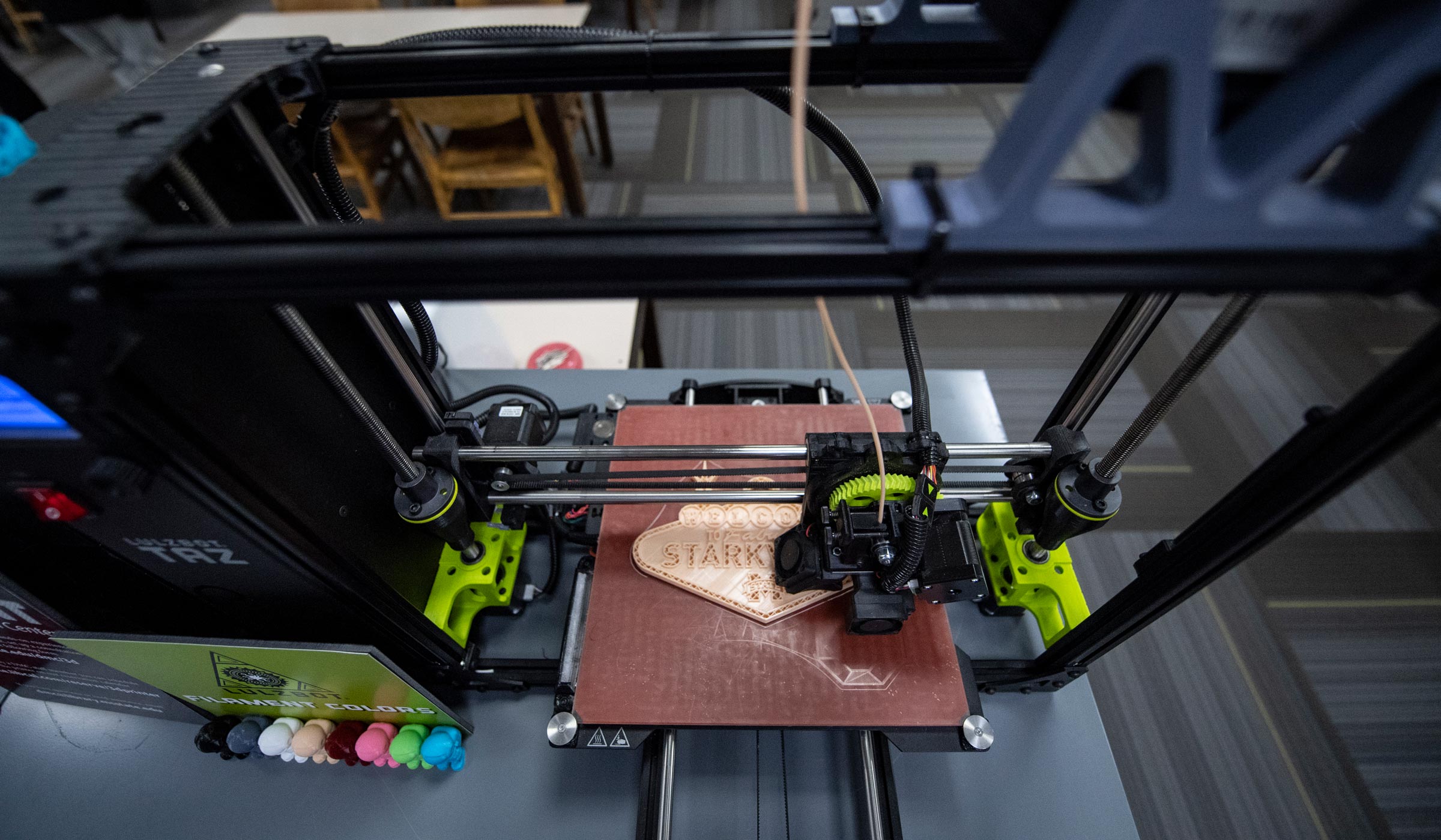3D printer in the new Digital Media Center prints a Starkvegas emblem.