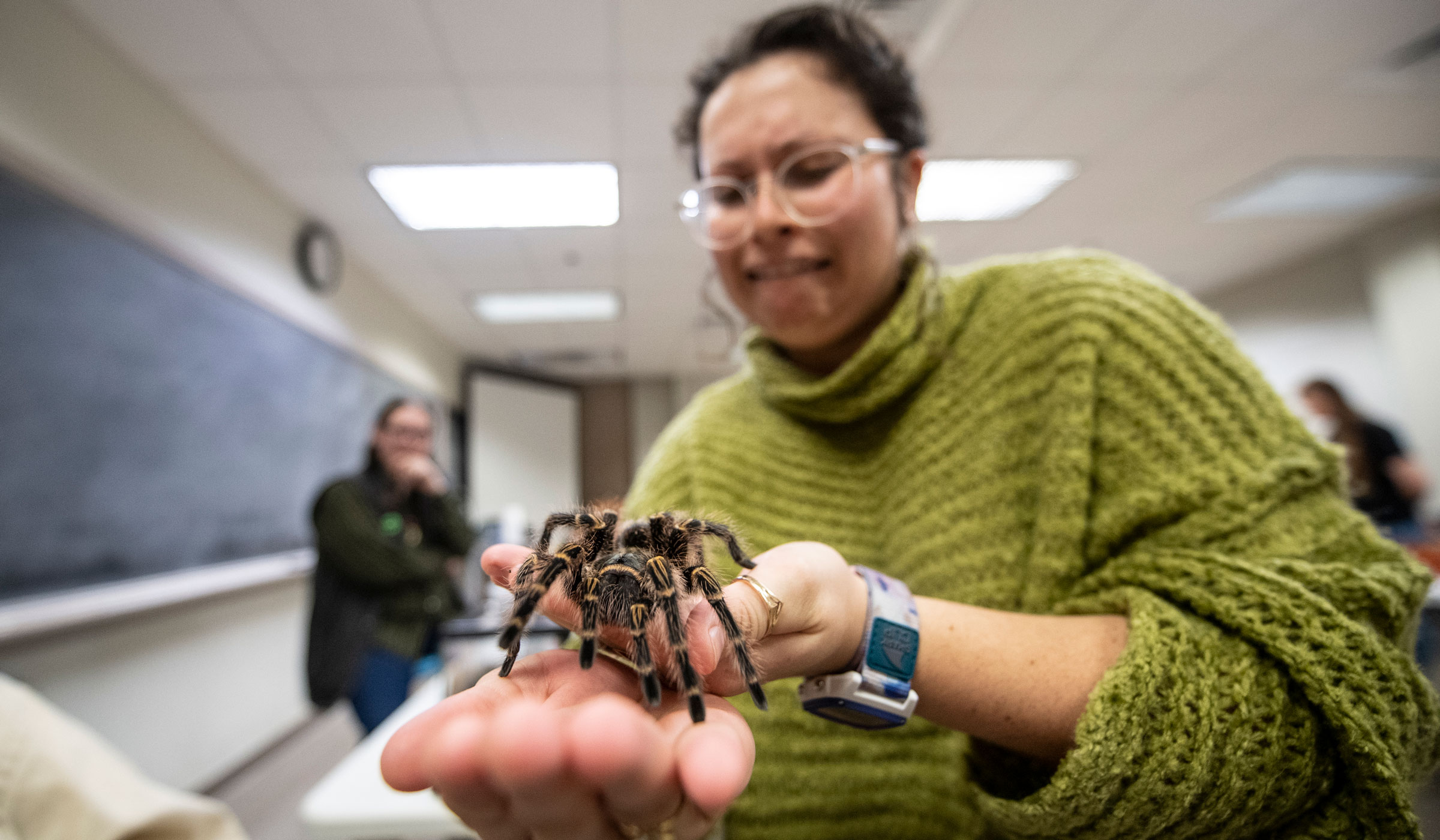Nadia Nelson conquers her fear and holds one of Science Night&#039;s most famous attendees a tarantula named The Ambassador.