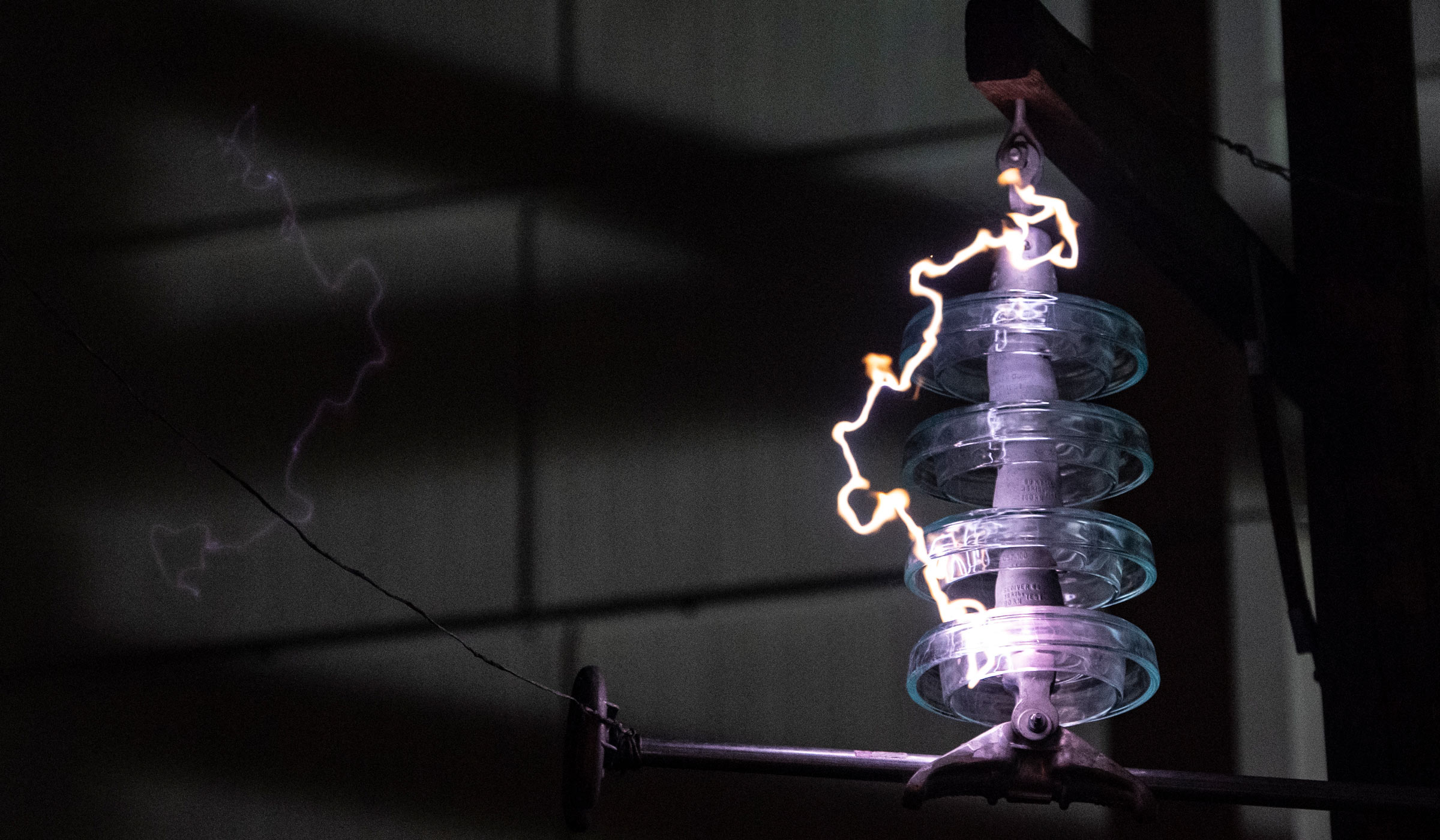 A bolt of electricity is visible in the High Voltage Lab.