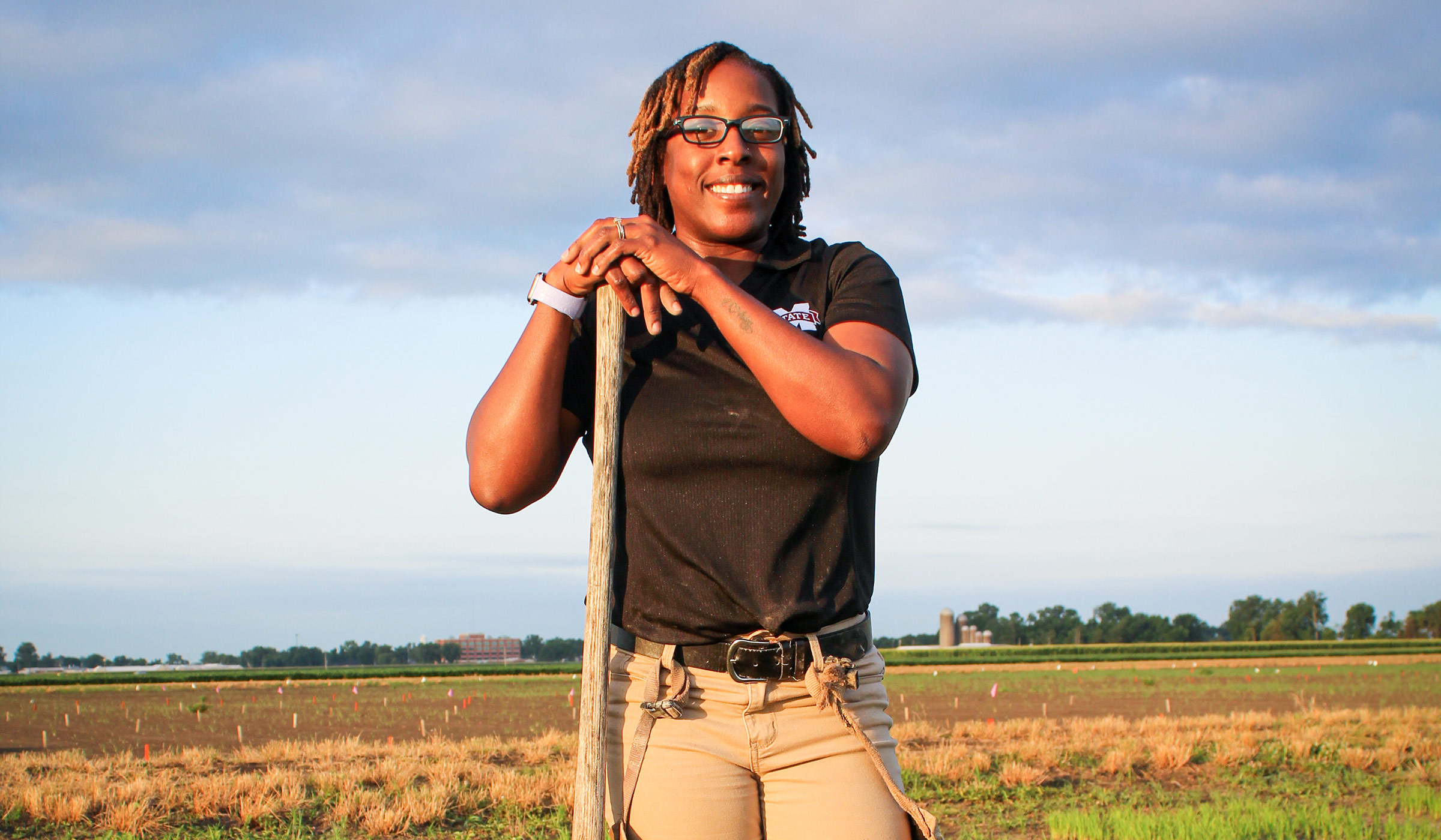 Tameka Sanders, pictured in agricultural research field.