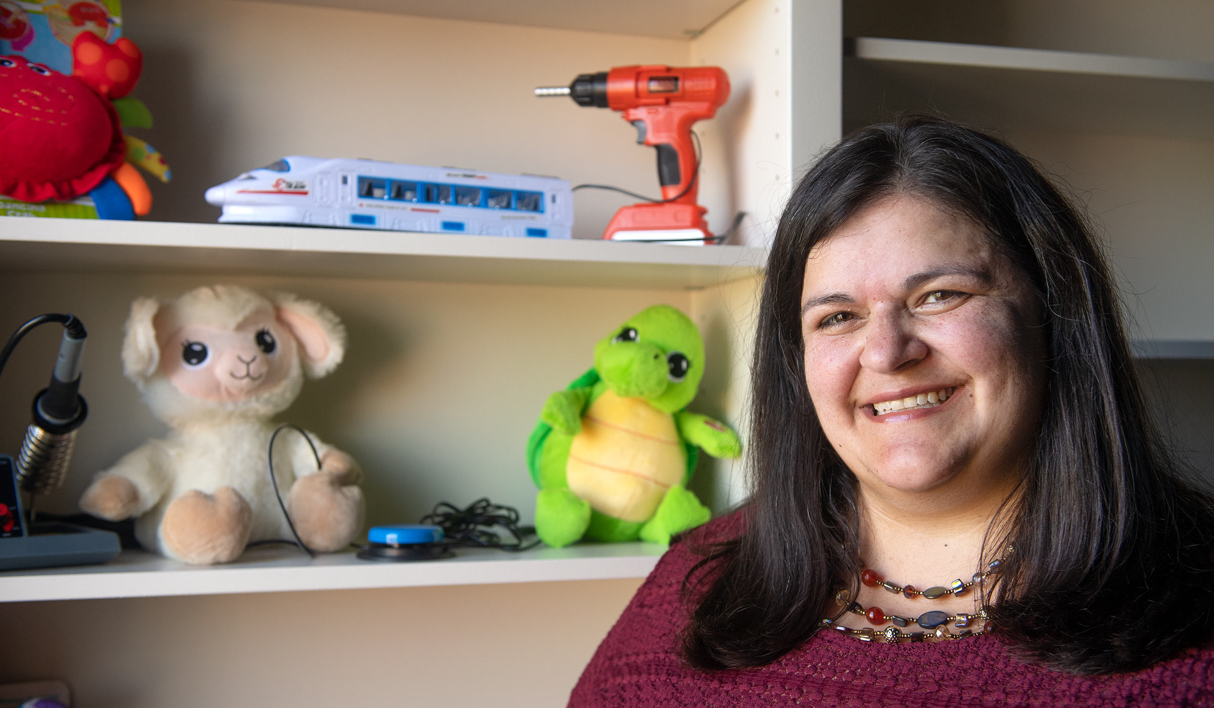 Jean Mohammadi-Aragh, pictured in front of a shelf of toys in her office.