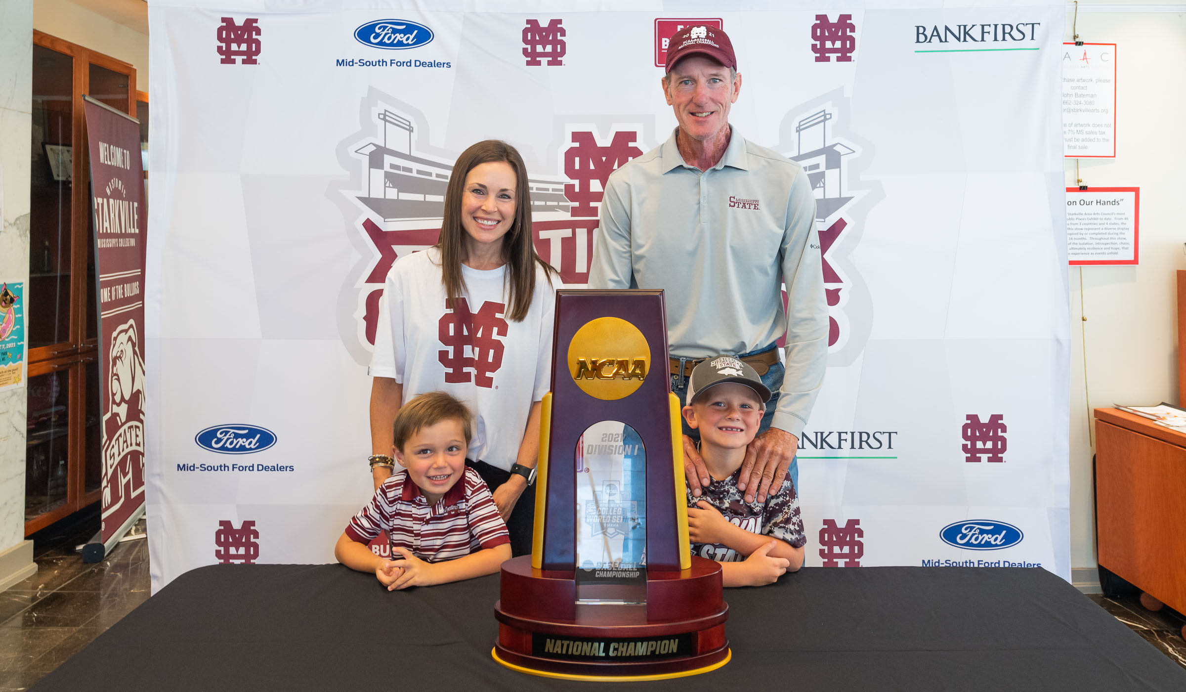 Family posing with National Championship Trophy