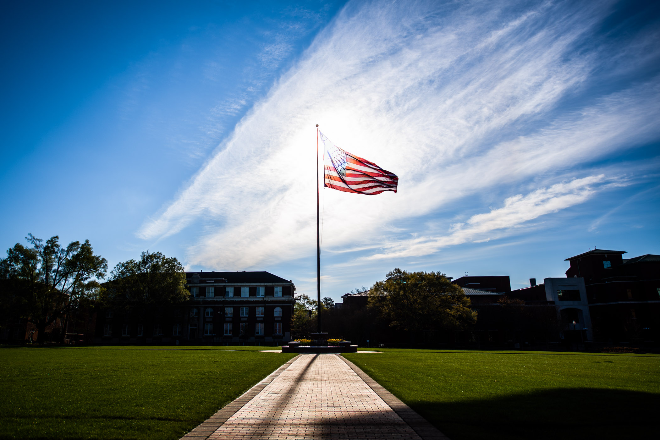 The American flag waves over MSU&#039;s historic Drill Field on a sunny morning. 