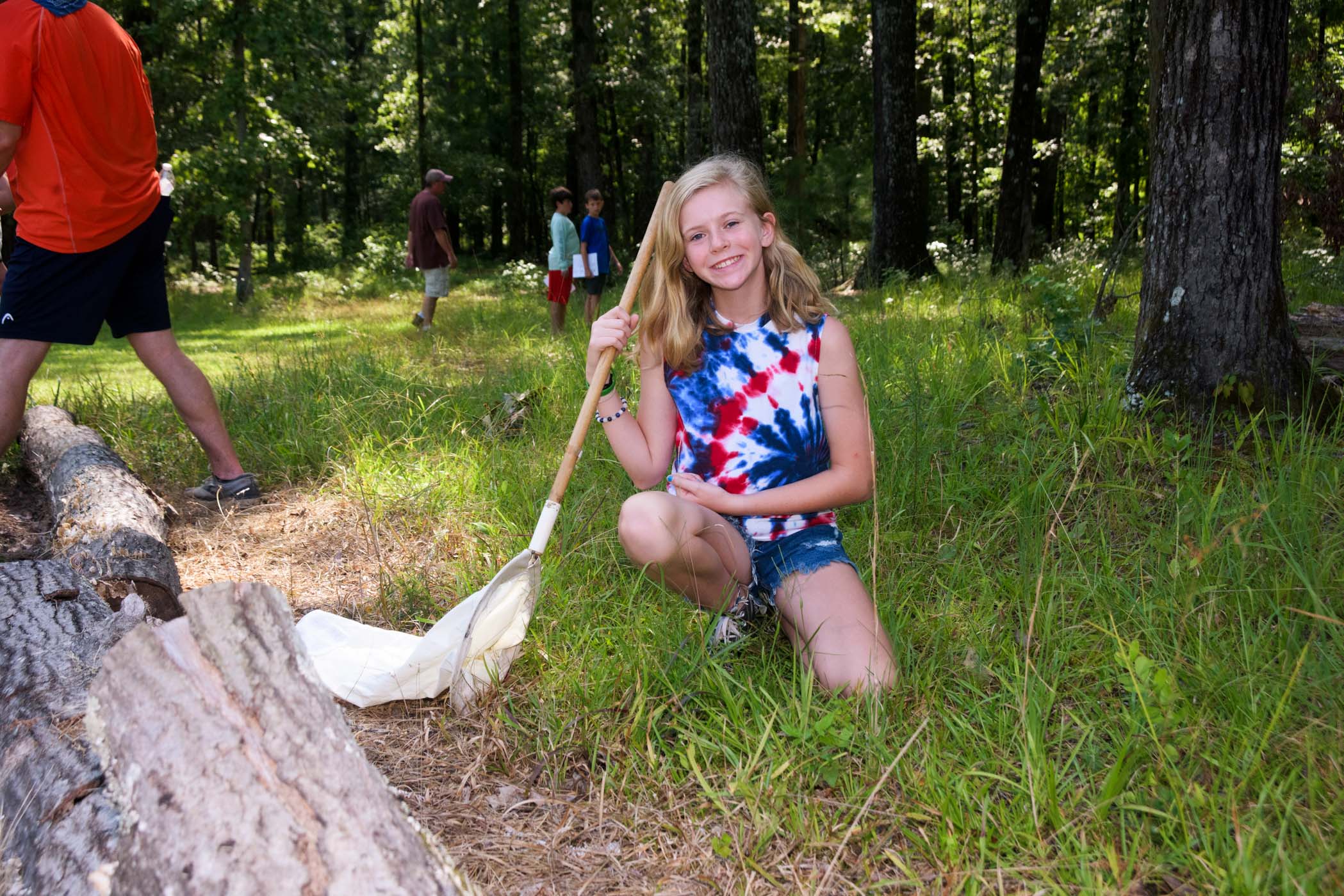 Caleigh Barnes, a participant in MSU Extension&#039;s 4-H E.A.R.T.H (Environmental Awareness through Recreation, Technology, and Health) Camp uses her net to capture and observe different insects.
