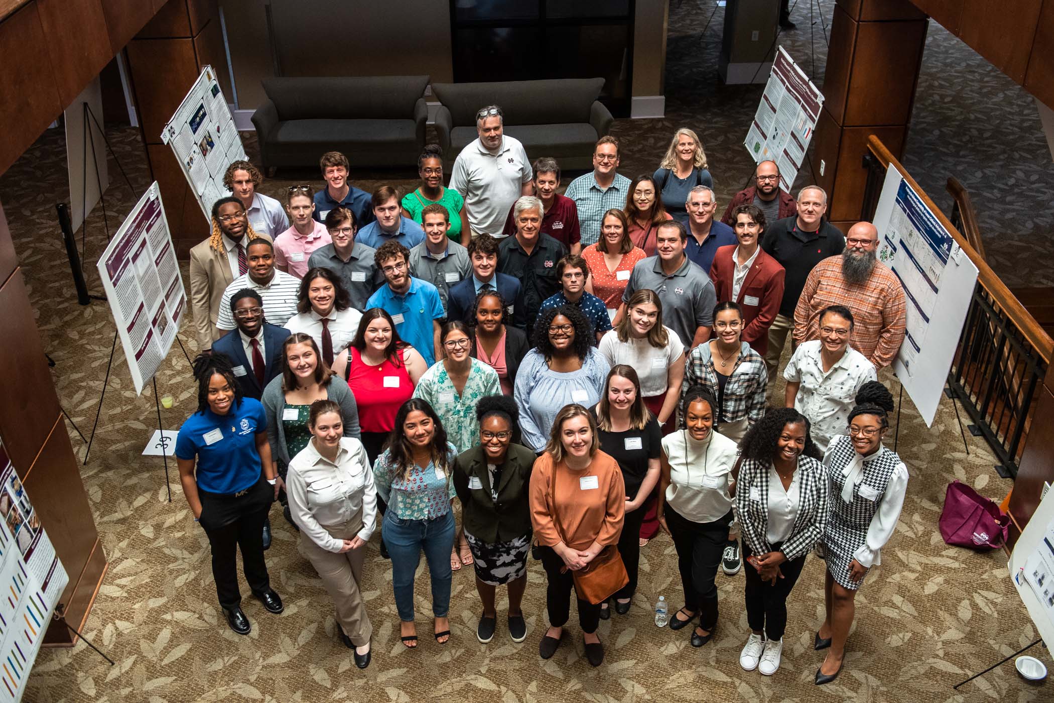 Student presenters and staff smile for a group photo for the 2023 Undergraduate Research Showcase.