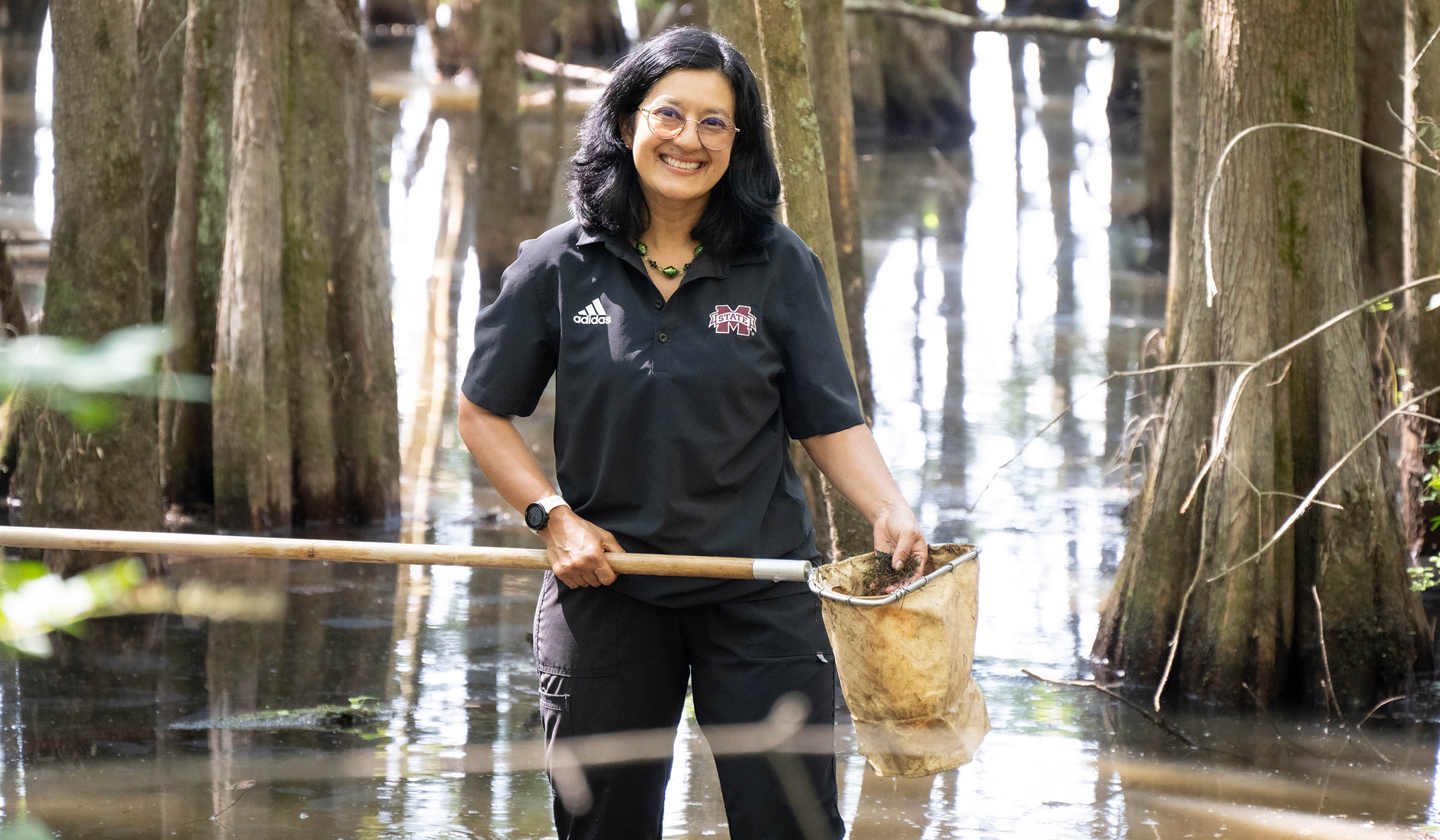 Sandra Correa, pictured wading in shallow waters at the Noxubee National Wildlife Refuge.