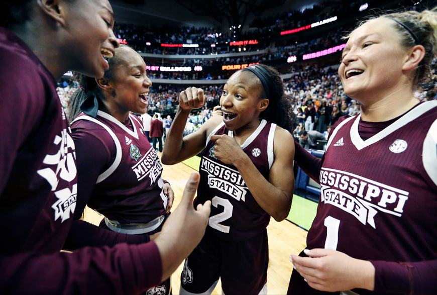 Womens Basketball teammates celebrate after winning against University of Connecticut Final Four game