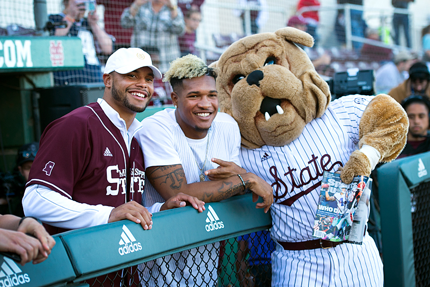 Dak Prescott receives some counsel from Bully &amp;amp; Fred Ross before throwing out the first pitch.