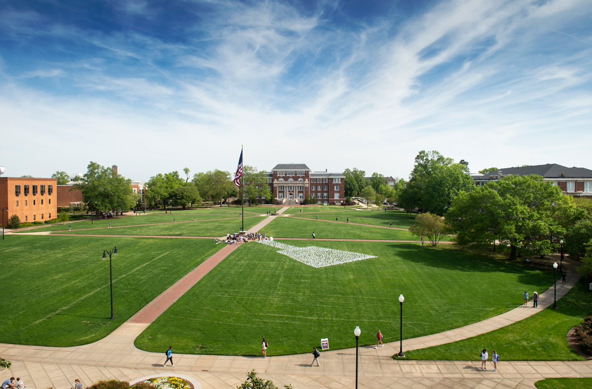 Looking down on the Drill Field from Swalm, a cowbell made from over 3,000 flags celebrates MSU&amp;#039;s graduate students.