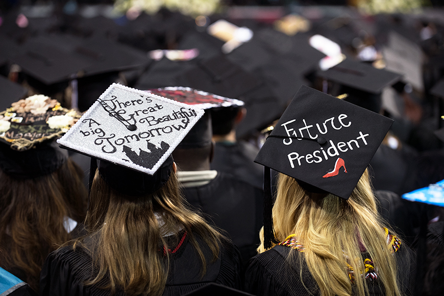 Decorated graduation caps with hopeful messages of &amp;quot;Future President&amp;quot; and &amp;quot;There&amp;#039;s a Great Big Bright Tomorrow.&amp;quot;
