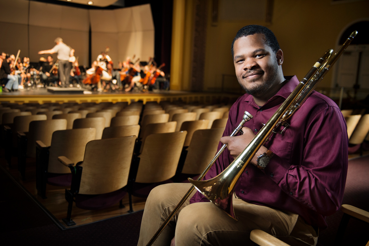 Davien Watkins, pictured with his trombone in a performance venue.