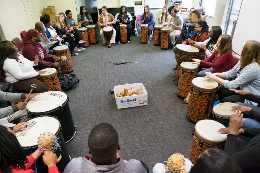 Student drum circle in African American music class led by Professor Robert Damm