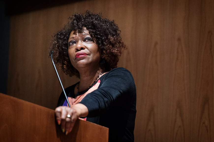Rita Dove, 2017 Writer in Residence, reading her poetry from a podium.