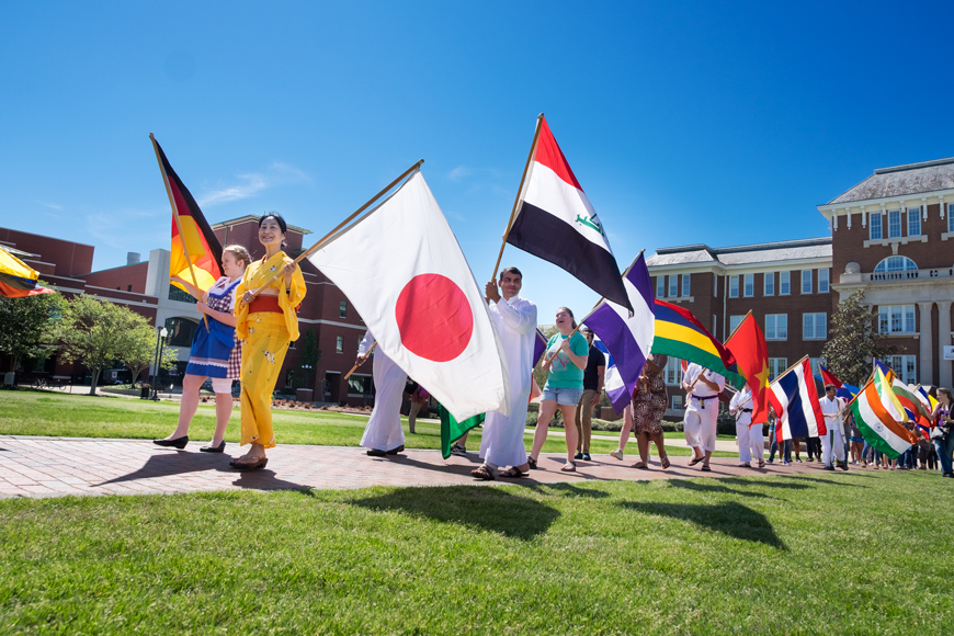 International Fiesta 2017 kids off with a parade of flags across the Drill Field