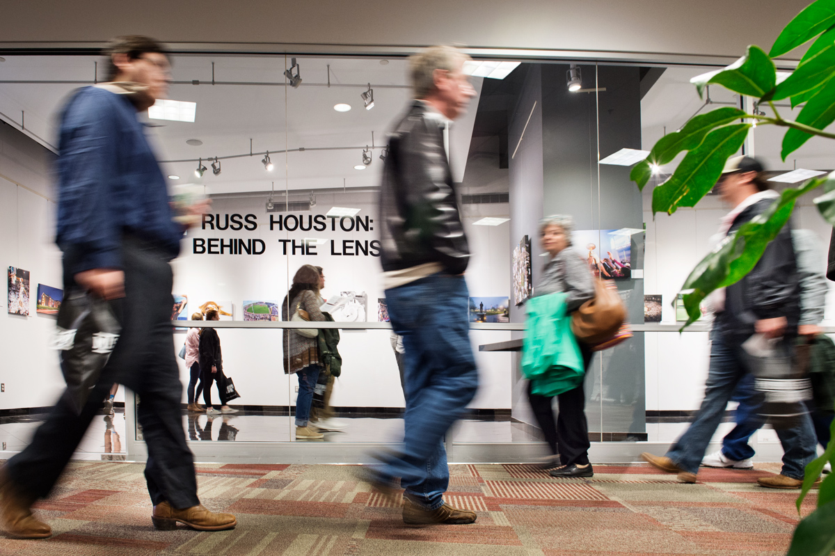 Spring Preview Day&amp;#039;s prospective students and their parents walk past MSU Photographer Russ Houston&amp;#039;s Union gallery exhibit. 