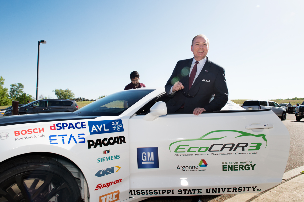 President Keenum enters EcoCAR3 to before driving it around the Research Park.