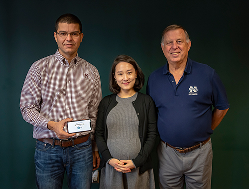 The Mississippi State team that has developed an app to determine stiffness of individual pieces of lumber include, from left, Frederico Franca, assistant research professor of sustainable bioproducts; Songyi “May” Han, an MSU sustainable bioproducts doctoral student; and professor Dan Seale. The team’s work is part of the university’s Forest and Wildlife Research Center. (Photo by David Ammon)