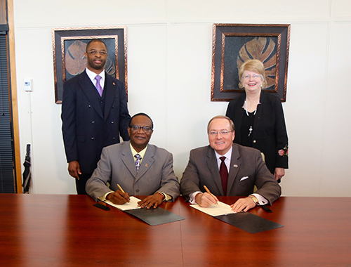 Alcorn State University Interim President Donzell Lee, seated from left, and MSU President Mark E. Keenum signed a memorandum of understanding Thursday [Feb. 21] to establish a program that will allow students to earn bachelor's degrees from both universities. Looking on are ASU Interim Provost and Vice President for Academic Affairs John Igwebuike and MSU Provost and Executive Vice President Judy Bonner.