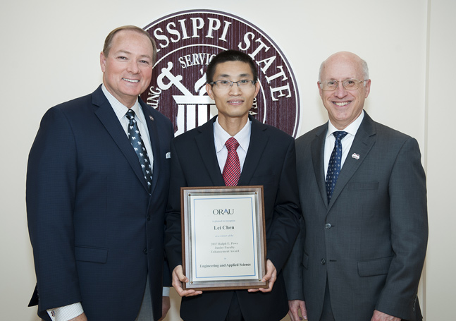 MSU Assistant Professor of Mechanical Engineering Lei Chen, pictured with MSU President Mark E. Keenum (left) and MSU Vice President for Research and Economic Development David Shaw (right), has received the Ralph E. Powe Junior Faculty Enhancement Award from Oak Ridge Associated Universities. (Photo by Russ Houston)
