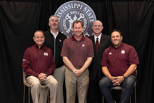 MSU coaches pose for a picture before the Summit for Scouting
