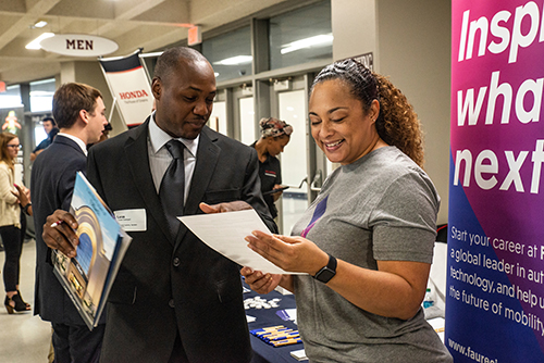 An MSU student speaks with an employer representative at MSU's fall 2018 Career Days.