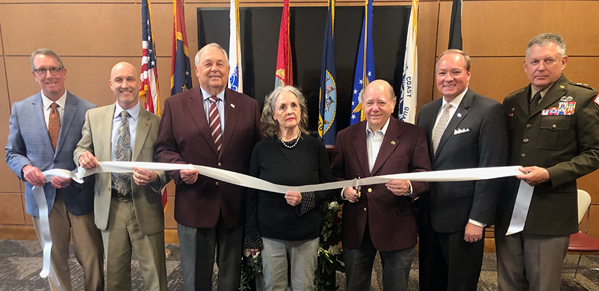 Cutting a ribbon for the new Carl Ray Furr Jr. Conference Room in Mississippi State’s G.V. “Sonny” Montgomery Center for America’s Veterans at Nusz Hall are, from left, Bennett Evans, senior director of development with the MSU Foundation; Brian Locke, director of the Montgomery Center for America’s Veterans; Richard Rula, MSU’s 2019 National Alumnus; Gail and Carl Ray Furr Sr., parents of Carl Ray Furr Jr.; MSU President Mark E. Keenum; and Mississippi National Guard Adjutant General Durr Boyles 