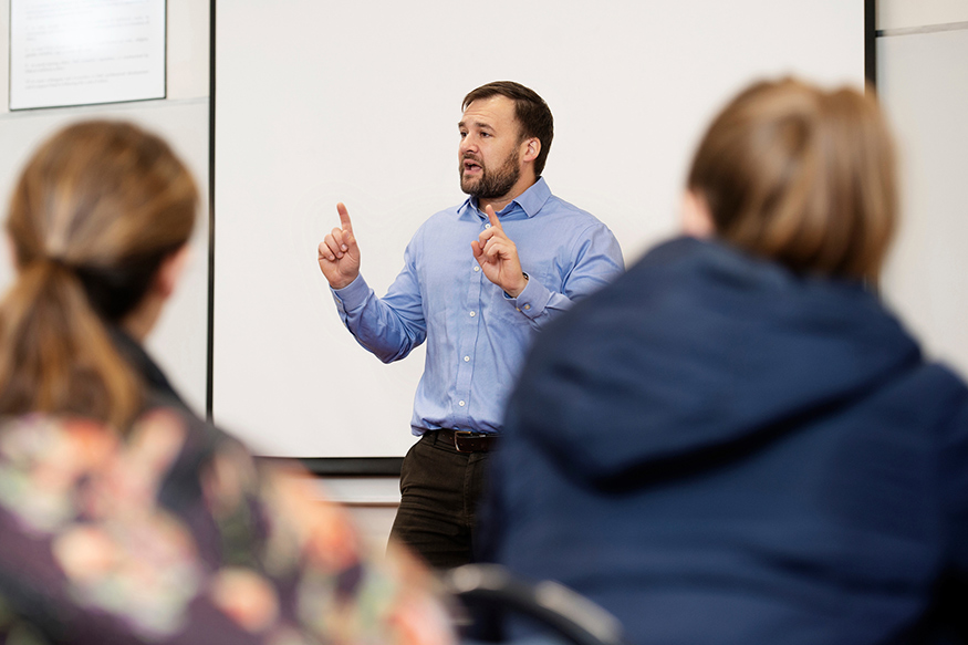 Brian Shoup, MSU associate professor of political science and public administration, speaks to students in a classroom setting.