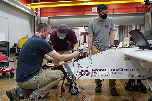 Engineers work to fine-tune an unmanned aircraft at Raspet.