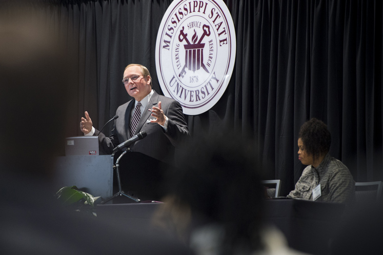 MSU President Mark E. Keenum speaks at the 2017 Diversity Conference while Lakiesha Williams, associate professor of agricultural and biological engineering and chair of the President’s Commission on the Status of Minorities, looks on. (Photo by Russ Houston)
