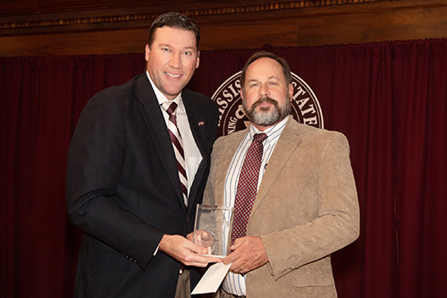 MSU Alumni Association Executive Director Jeff Davis congratulates Brian Baldwin, recipient of the MSU Alumni Association’s Graduate Teaching Excellence Award. (Photo by Beth Wynn)