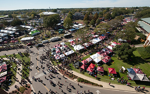 An aerial view of MSU's campus with crowded streets on gameday.
