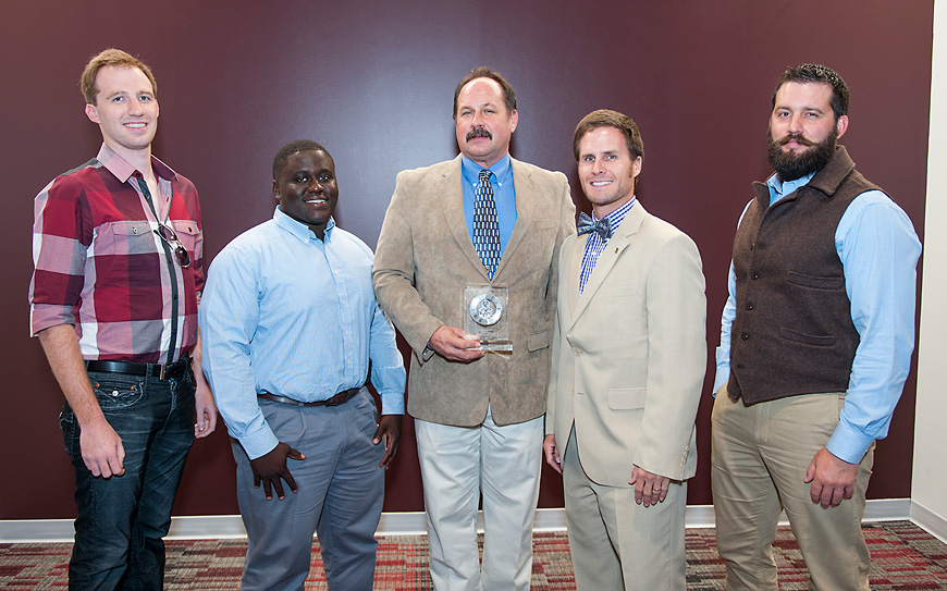 Professor Brian Baldwin (center) is the MSU Graduate Student Association’s selection for the Outstanding Graduate Student Mentor of the Year Award. Also pictured are his plant and soil sciences department graduate students, including (from left) Eric D. Billman, John Q. McLemore, Jonathan D. “Johnny” Richwine and Jesse I. Morrison. (Photo by Russ Houston)
