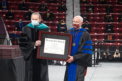Mississippi State alumnus Hassell H. Franklin, left, receives an honorary Doctor of Public Service degree from MSU Provost and Executive Vice President David Shaw.