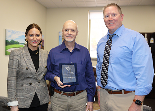 Merrill Warkentin, center, MSU’s James J. Rouse Endowed Professor of Information Systems and new Association for Information Systems Fellow, is pictured with Department of Management and Information Systems Professor and Head Laura Marler, and College of Business Dean Scott Grawe. 