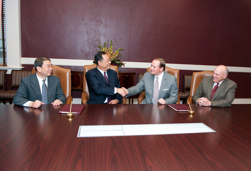 Signing a Memorandum of Agreement to establish a dual degree program in forestry Dec. 1 were (l-r) Shandong Agricultural University representatives Dean of the College of Forestry Liu Xunli and Vice President Xinsheng Dong, along with MSU President Mark E. Keenum and MSU Dean of the College of Forest Resources and the College of Agriculture and Life Sciences George Hopper. (Photo by Russ Houston)