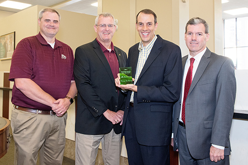 Mississippi State University’s Department of Student Financial Aid recently was honored with the Regions Bank Marketing Partner Rock Star Award. Pictured are, left to right, Jay Willis, branch manager for Regions Bank in Starkville; Sammy Slaughter, senior vice president and city president for Regions Bank in Starkville; John Daniels, MSU financial literary coordinator; and Paul McKinney, MSU student financial aid director. (Photo by Beth Wynn)