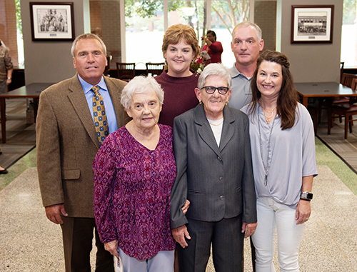 MSU alumna Janice I. Nicholson, facility benefactor, center front, with her brother’s family, front left, wife Mary Jane McGee Nicholson, an MSU alumna; front right, daughter-in-law Sherri Nicholson; and back from left, son-in-law Chris Barr, daughter and MSU alumna Jane Nicholson Barr, and son and MSU alumnus James W. Nicholson III. 