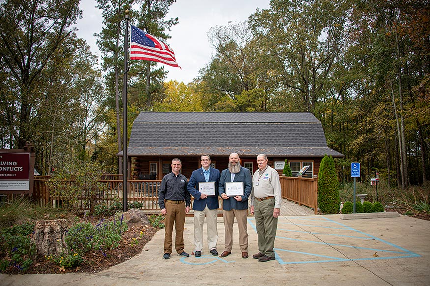 From left, Scott Edwards, MSU Extension instructor and Army National Guard chaplain, presents Andy Kouba, Wildlife, Fisheries and Aquaculture department head, and Chad Dacus, MSU Extension instructor, with the Patriot Award. Also on hand is Jimmy Vaughan, Mississippi area chair for the Employer Support of the Guard and Reserve. 
