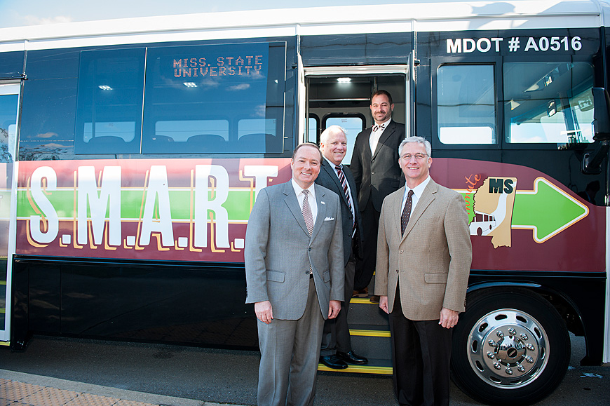 The Starkville-MSU Area Rapid Transit system opened a new route Monday [Jan. 4] to the Golden Triangle Regional Airport in Lowndes County. Pictured following a ribbon-cutting ceremony for the route are (l-r) MSU President Mark E. Keenum; GTR Executive Director Mike Hainsey; Jeremiah Dumas, MSU director for parking, transit and sustainability; and Mike Tagert, transportation commissioner for northern Mississippi. (Photo by Russ Houston)