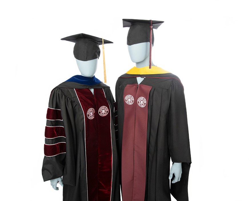 Two mannequins model doctoral and master’s degree gown regalia with maroon detailing.