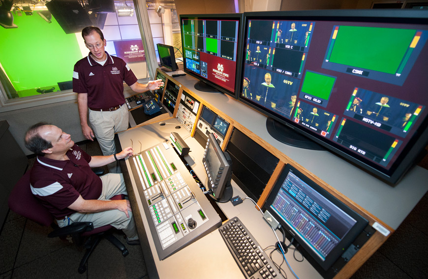 University Television Center Director David Garraway (standing) talks with UTC Operations and Engineering Manager Mike Godwin as they work in the state-of-the-art broadcasting center, which now offers Mississippi State’s TV channel, MSTV, statewide. (Photo by Russ Houston)