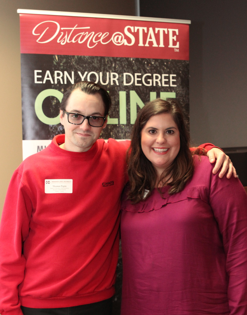 Thomas Pepin, an MBA graduate from Toronto, Canada, and MSU Center for Distance Education Coordinator Hope Durst visit at the recent graduation reception. (Photo submitted)