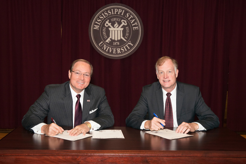 MSU President Mark E. Keenum and USDA APHIS Wildlife Services Deputy Administrator William H. Clay signed a “Resolution for Collaboration” to create a national training academy housed at Mississippi State. (Photo by Beth Wynn)