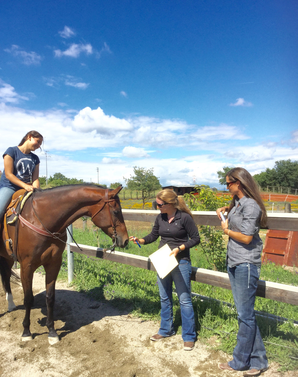 Participant Francesca Romana Faro (l-r) gets direction from MSU equestrian team member Ashley Palmer and MSU equestrian team head coach Ashley Shiffler. (Photo submitted)