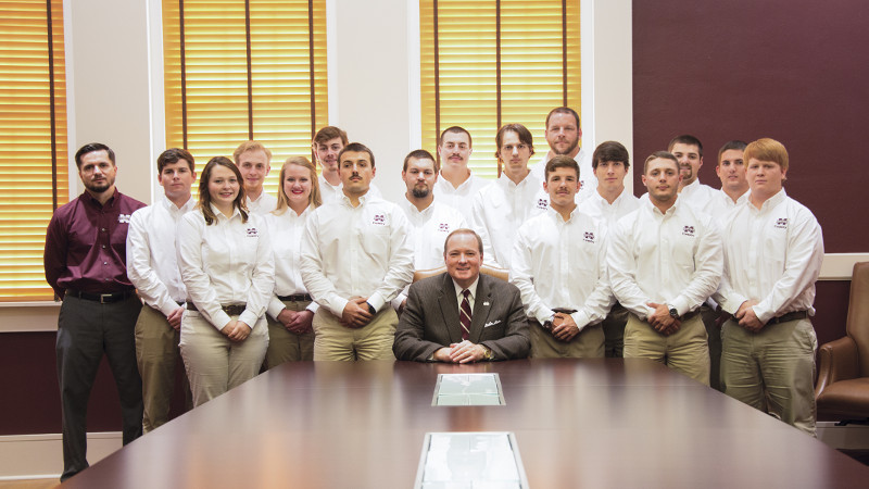 Mississippi State President Mark E. Keenum (seated, center) with members of the multiple award-winning Society of American Foresters student chapter. The university group includes (front, l-r) Savannah Fenaes, Preston Bush, Collie Fox, Tanner Robinson, Chandler Guy, Tyler Thomas, (back, l-r) faculty adviser Robert Grala, Drew Ethridge, Zach Pardue, Jade McCarley, Davis Pigg, Kaleb Ross, Kevin Young, Jason Warner, Reed Kirkpatrick, Clayton Cooper, and Steven Gray. (Photo by David Ammon)