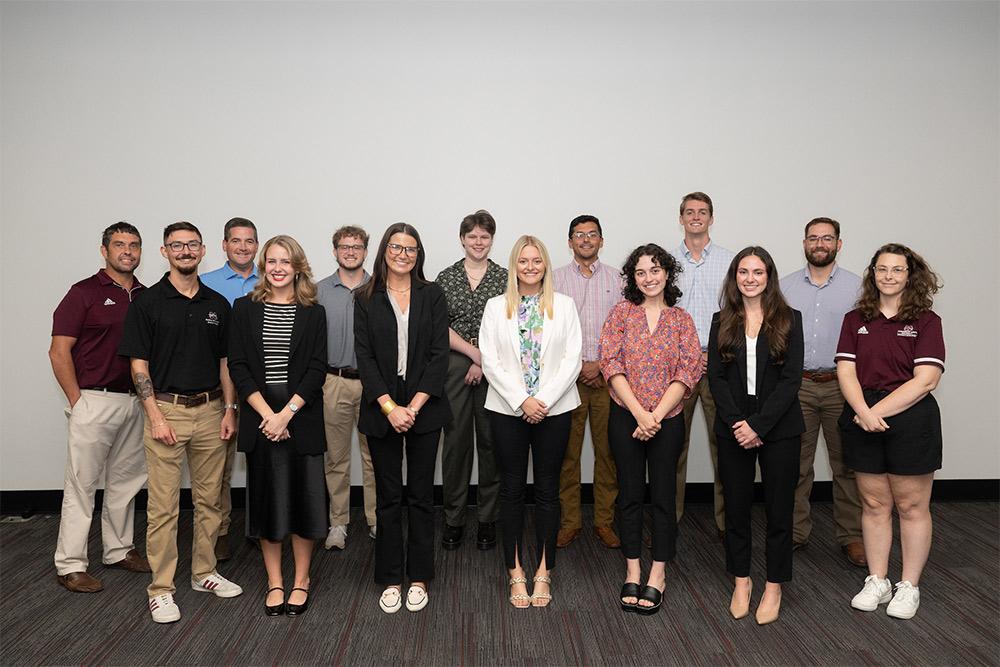 The third-place winners for their “APEX” project are Team 9 members, pictured with sponsors