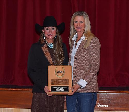 Bricklee Miller, left, accepts the Justin Boots Best Footing Award on behalf of the Mississippi Horse Park and Starkville Rotary Club from Sherry Cervi, a four-time world champion WPRA barrel racer and member of the National Cowgirl Hall of Fame.
