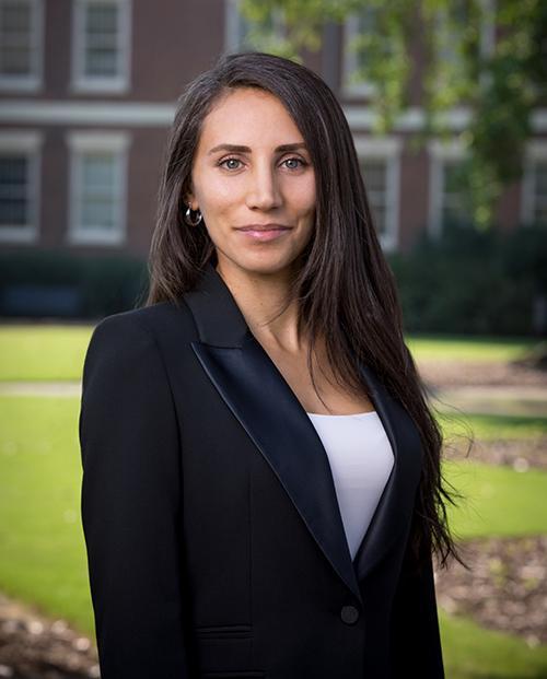 An outdoor portrait of Ayça Fackler.
