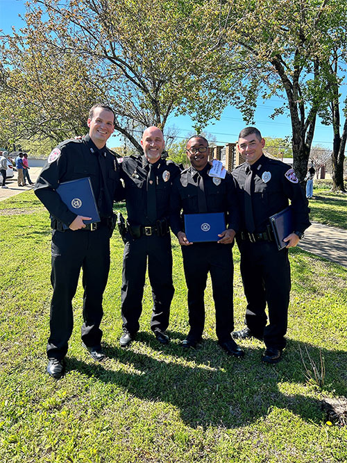 Mississippi State University Assistant Police Chief Brian Locke, second from left, recently congratulated MSUPD officers Tyler Hawkins, left, Deveair Salter, and William Bowling on their graduation from the North Mississippi Law Enforcement Training Academy