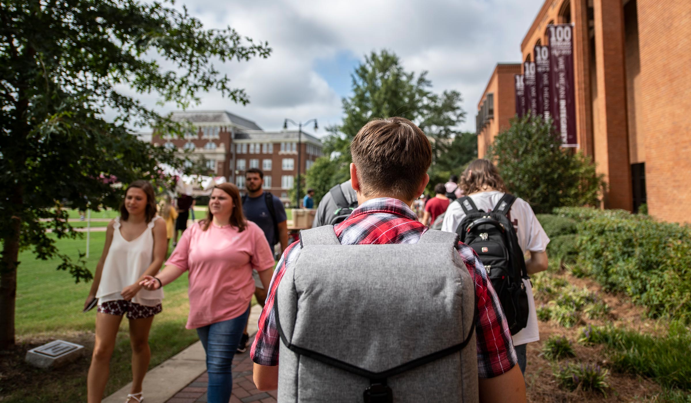 Students walk on the sidewalk during the first day of class for the 2019 Fall Semester.